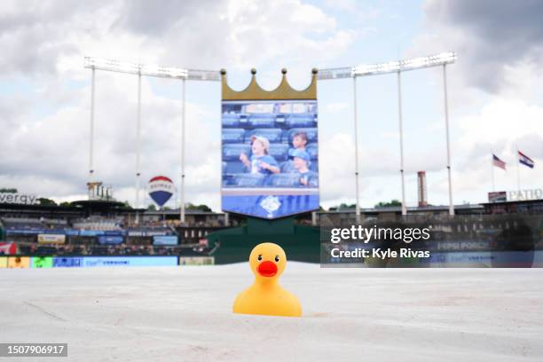 Rubber duck sits on the tarp as the Kansas City Royals and the Los Angeles Dodgers game went under a rain delay before the start of the game at...