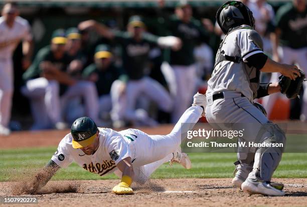 Tyler Wade of the Oakland Athletics scores the winning run against the Chicago White Sox in the bottom of the 10th inning at RingCentral Coliseum on...