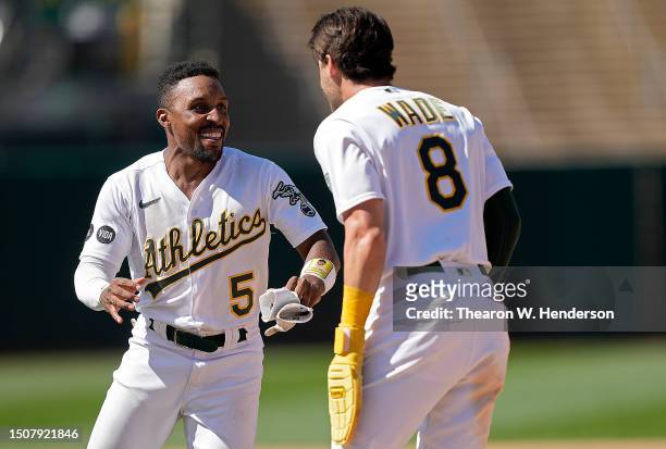 Tyler Wade and Tony Kemp of the Oakland Athletics celebrates after Wade scored the winning run against the Chicago White Sox in the bottom of the...