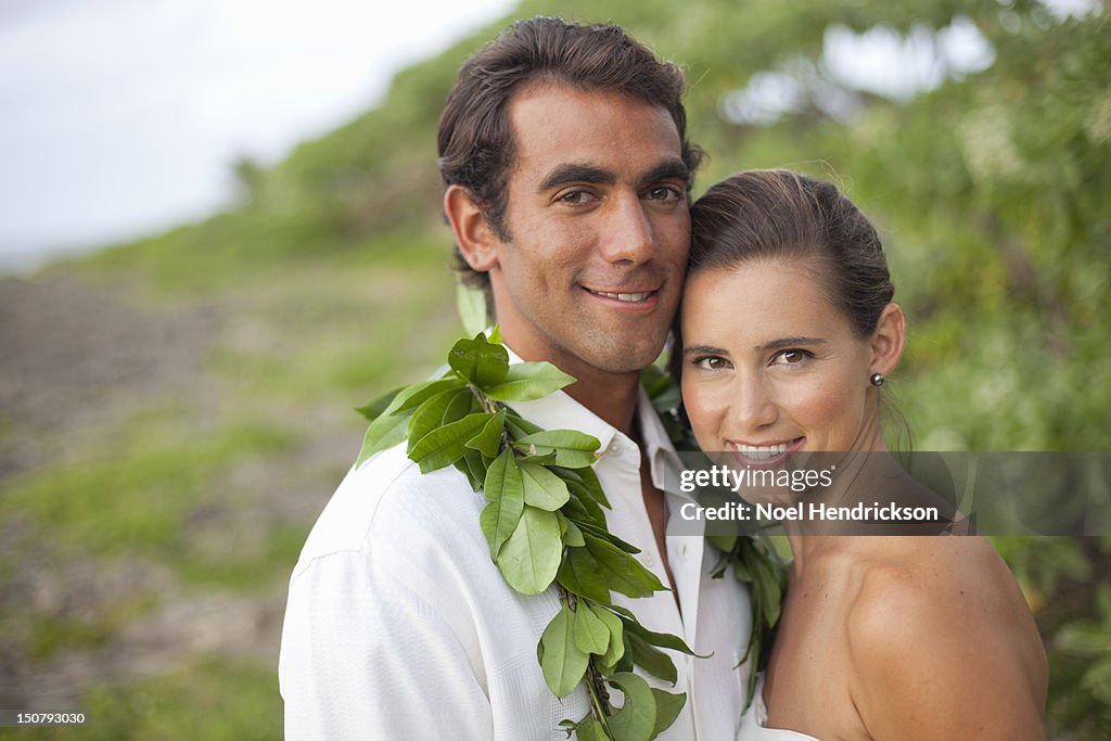 A bride and groom on their beach wedding day