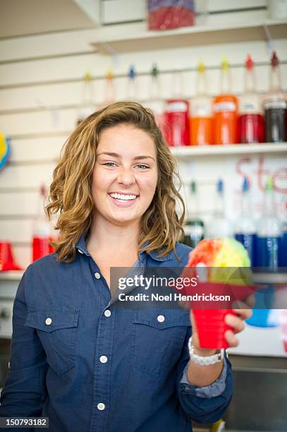 a young woman serves hawaiian shaved ice - snow cones shaved ice stock pictures, royalty-free photos & images