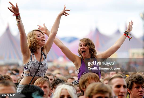 Fans soak up the atmopshere as Eagles of Death Metal perform live on the Main Stage on Day Three during the Reading Festival 2012 at Richfield Avenue...