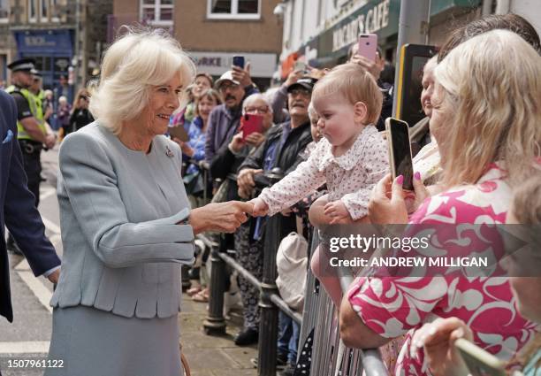 Britain's Queen Camilla meets well-wishers after a visit to The great Tapestry of Scotland visitor centre in Galashiels, south of Edinburgh on July 6...