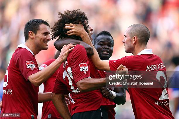 Felipe celebrates the first goal with Mario Eggimann , Didier Ya Konan and Leon Andreasen of Hannover during the Bundesliga match between Hannover 96...