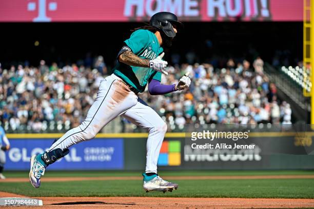 Crawford of the Seattle Mariners gestures after hitting a solo home run during the third inning against the Tampa Bay Rays at T-Mobile Park on July...