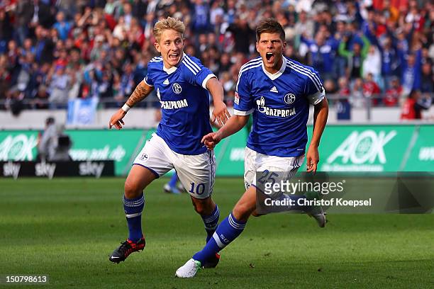 Klaas-Jan Huntelaar of Schalke celebrates the first goal with Lewis Holtby of Schalke during the Bundesliga match between Hannover 96 and FC Schalke...