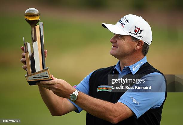 Paul Lawrie of Scotland with the winners trophy during the final round of the Johnnie Walker Championship on the PGA Centenary Course at Gleneagles...