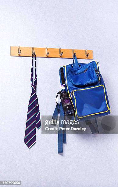 tie and bag hanging in a school classroom - portemanteau photos et images de collection