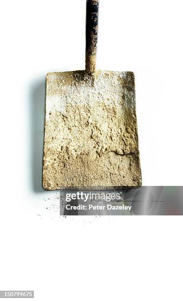 a well-used spade covered in cement dust - construction material stock pictures, royalty-free photos & images