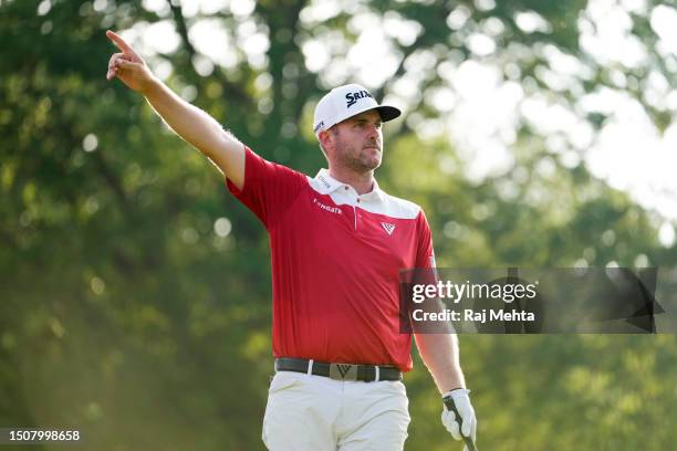 Taylor Pendrith of Canada reacts to his shot from the 18th tee during the third round of the Rocket Mortgage Classic at Detroit Golf Club on July 01,...