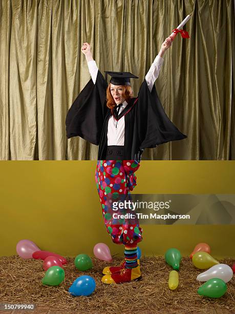 female graduate top, clown bottom - poes stock pictures, royalty-free photos & images