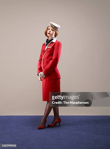 portrait of airline hostess - flight attendant stock pictures, royalty-free photos & images