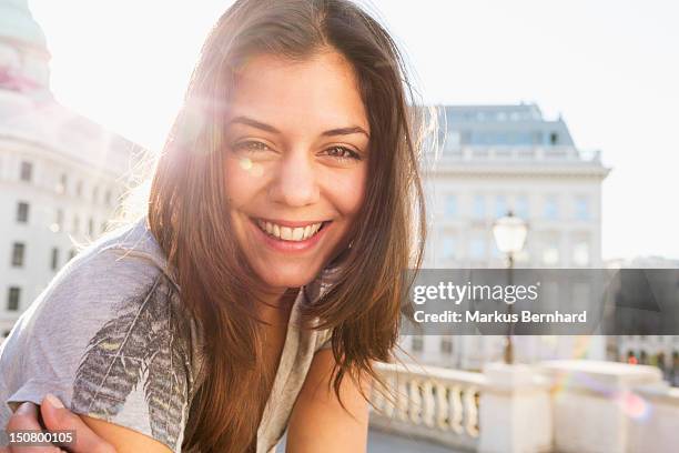 confident woman smiling. - happy woman in early morning sunlight stock-fotos und bilder