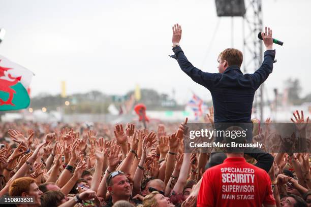 Ricky Wilson of Kaiser Chiefs performs on the main stage during Day 3 of Reading Festival at Richfield Avenue on August 26, 2012 in Reading, United...