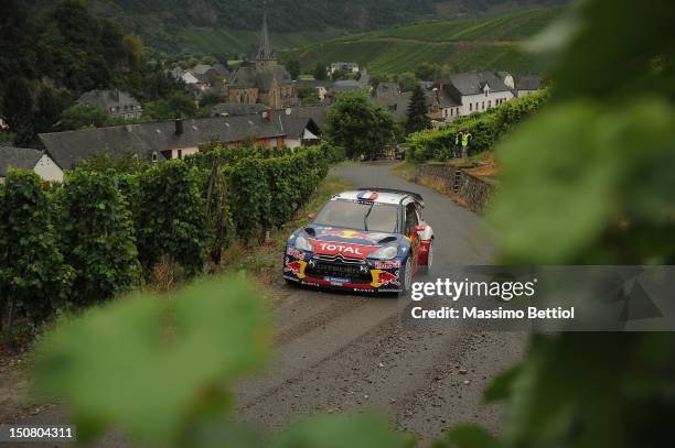 Sebastien Loeb of France and Daniel Elena of Monaco compete in their Citroen Total WRT Citroen DS3 WRC during Day 3 of the WRC Rally Germany on...