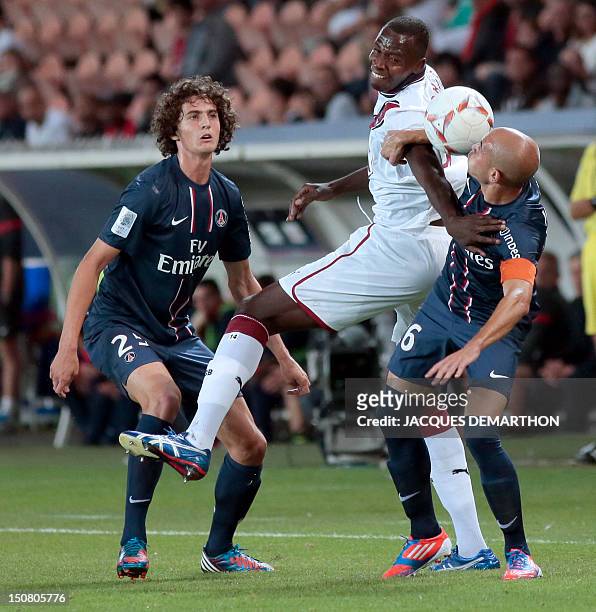 Bordeaux's Malian forward Cheick Tidiane Diabate vies with Paris Saint-Germain's captain, French defender Christophe Jallet and Paris Saint-Germain's...