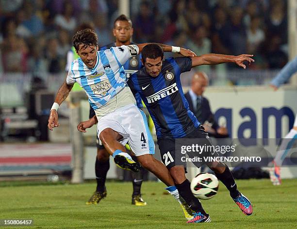 Inter Milan's Uruguayan midfielder Alejandro Walter Gargano fights for the ball with Pescara midfielder Emmanuel Cascione on August 26, 2012 during a...