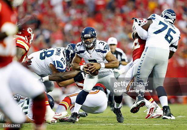 Quarterback Russell Wilson of the Seattle Seahawks in action during the NFL preseason game against the Kansas City Chiefs at Arrowhead Stadium on...