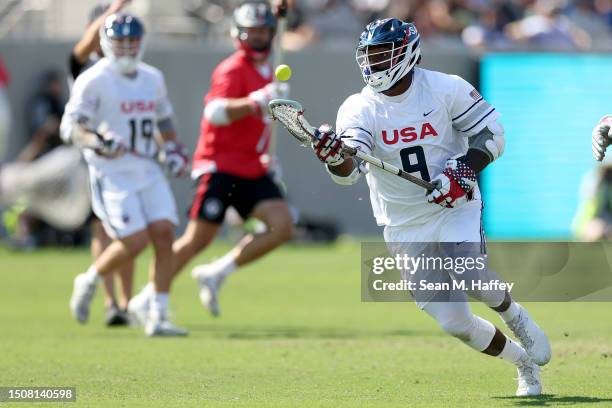 Trevor Baptiste of Team USA controls the ball during the first half of the World Lacrosse Men's Gold Medal match against Team Canada at Snapdragon...