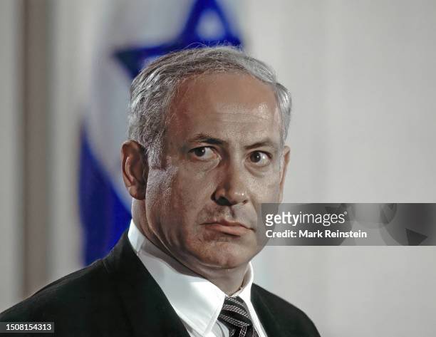 Israeli Prime Minister Benjamin Netanyahu responds to a reporters question during a joint news conference with United States President Bill Clinton...