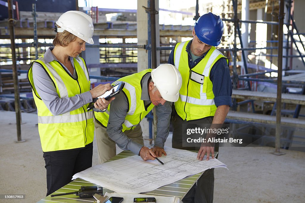 Building professionals meeting on site