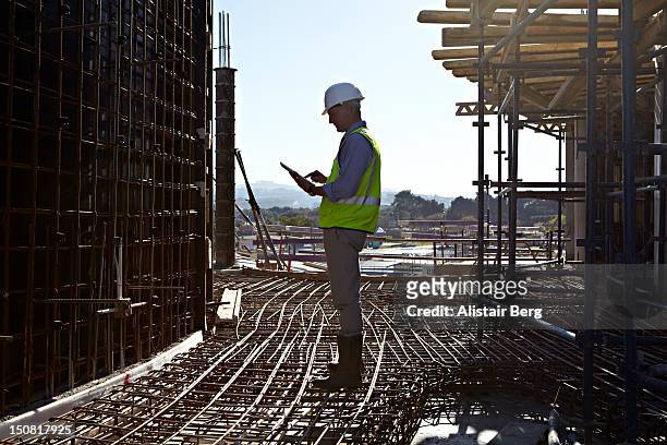 architect using tablet computer - architect on site stock pictures, royalty-free photos & images