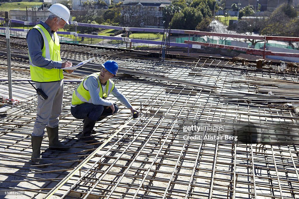 Building contractors discussing plans