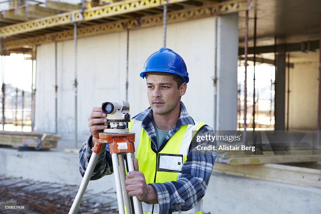 Surveyor on building site