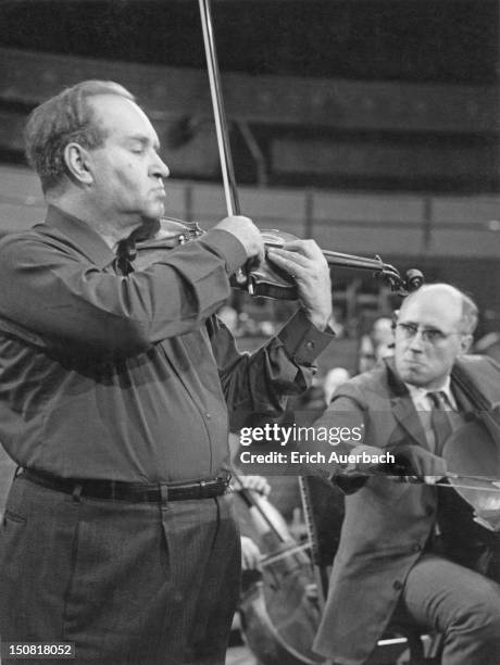 Russian violinist David Oistrakh performing Brahms' Double Concerto with Russian cellist Mstislav Rostropovich and the Moscow Philharmonic Orchestra...