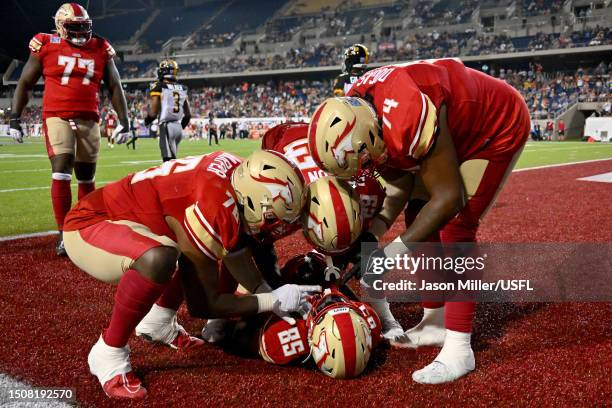 Deon Cain of the Birmingham Stallions celebrates with his teammates after scoring a 40 yard touchdown pass against the Pittsburgh Maulers during the...