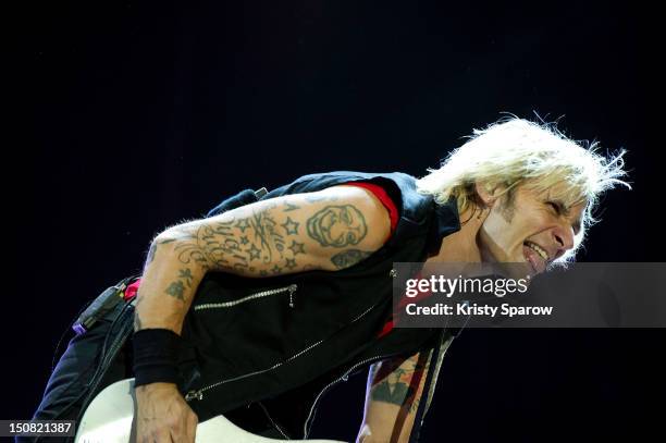 Mike Dirnt of Green Day performs onstage during the 10th annual Rock En Seine Festival at the Domaine National de Saint-Cloud park on August 26, 2012...