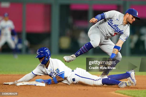 Dairon Blanco of the Kansas City Royals beats a tag by Miguel Vargas of the Los Angeles Dodgers during the seventh inning at Kauffman Stadium on July...
