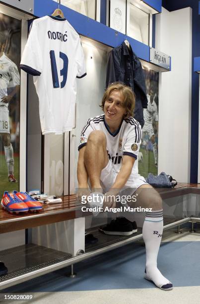 Luka Modric the new signing for Real Madrid dresses in locker room before his official presentation at Santiago Bernabeu stadium on August 27, 2012...