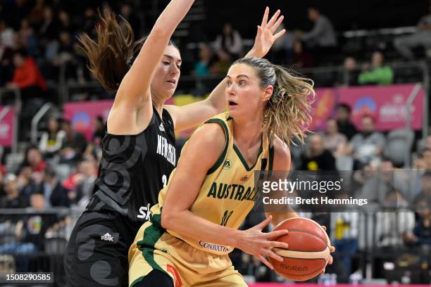 Alice Kunek of Australia is challenged by Esra McGoldrick of New Zealand during the 3rd place 2023 FIBA Women's Asia Cup match between Australia and...