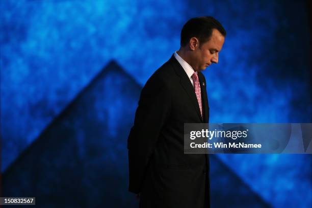 Chairman Reince Priebus stands on stage during teh start of the Republican National Convention at the Tampa Bay Times Forum on August 27, 2012 in...