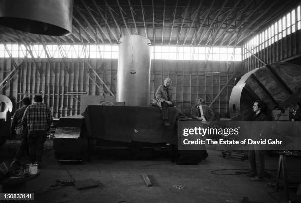 Sculptor and conceptual artist Claes Oldenburg poses for a portrait on May 15, 1969 during installation of his large-scale sculpture, Lipstick on...