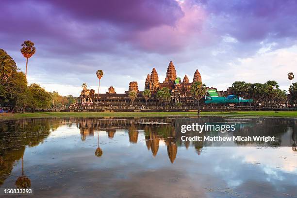 the angkor wat temple at sunset. - angkor wat stock pictures, royalty-free photos & images