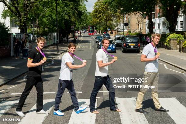 French athletes, Amaury Leveaux, Fabien Gilot, Clement Lefert and Yannick Agnel walking on the pedestrian-crossing of Abbey Road with their medals in...