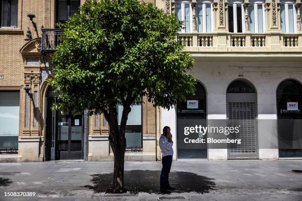 Man waits in the shade of a tree during high temperatures in Seville, Spain, on Thursday, July 6, 2023. Global temperatures hit a record on Monday,...