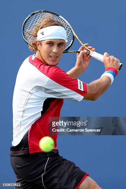 Lukas Lacko of Slovakia plays a backhand during his men's singles first round match against James Blake of the United States during Day One of the...