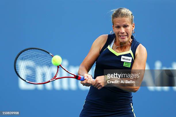 Melinda Czink of Hungary plays a forehand during her women's singles first round match against Maria Sharapova of Russia on Day One of the 2012 US...