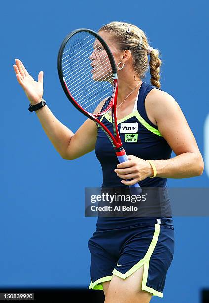 Melinda Czink of Hungary reacts after a point during her women's singles first round match against Maria Sharapova of Russia on Day One of the 2012...