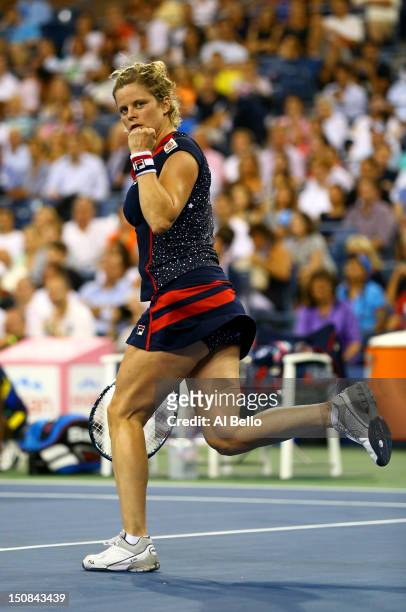 Kim Clijsters of Belgium celebrates after defeating Victoria Duval of the United States in their women's singles first round match against on Day One...