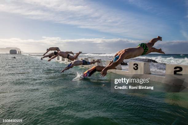 Swimmers take part in a winter swimming competition held by Merewether Mackerels swimming club at Merewether Ocean Baths on July 02, 2023 in...