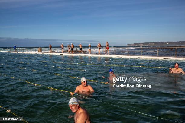 Swimmers take part in a winter swimming competition held by Merewether Mackerels swimming club at Merewether Ocean Baths on July 02, 2023 in...