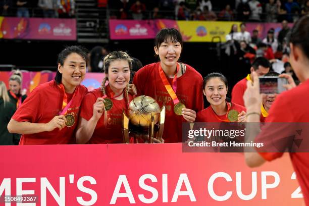 Gold medallists Team China celebrate with the FIBA Women's Asia Cup 2023 Champions Trophy during the medal ceremony after the 2023 FIBA Women's Asia...