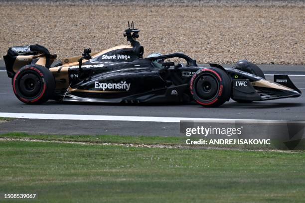 The car of the fictional Apex team for an F1-inspired movie moves along the track ahead of the Formula One British Grand Prix at the Silverstone...