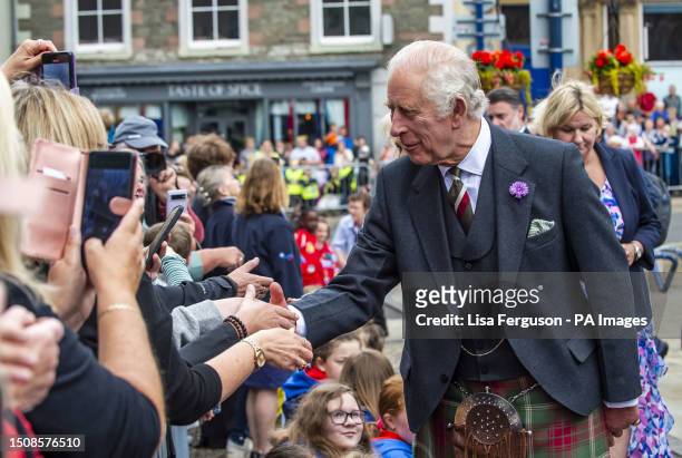 King Charles III greets well wishers during a tour of the market square in Selkirk, in the Scottish Borders, as part of the first Holyrood Week since...