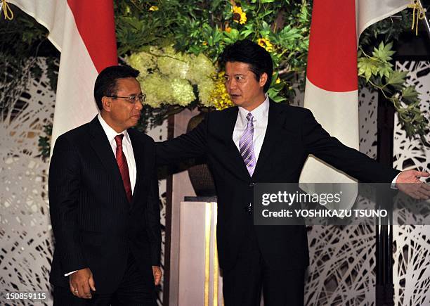 Indonesian Coordination Minister for Political, Legal, and Security Affairs, Djoko Suyanto , is greeted by Japanese Foreign Minister Koichiro Gemba...