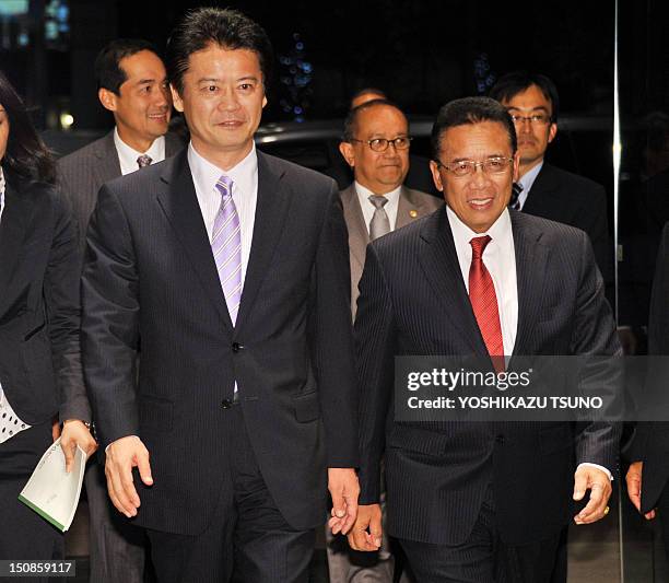 Indonesian Coordination Minister for Political, Legal, and Security Affairs, Djoko Suyanto and Japanese Foreign Minister Koichiro Gemba arrive for a...